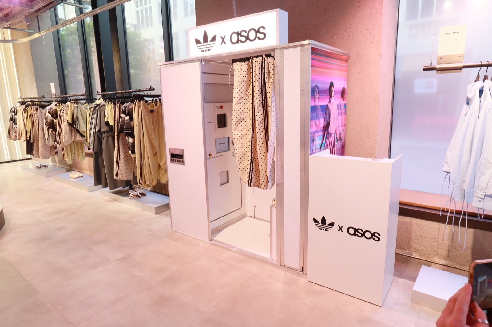 Completed Adidas and ASOS booth with patterned curtain in the retail space
