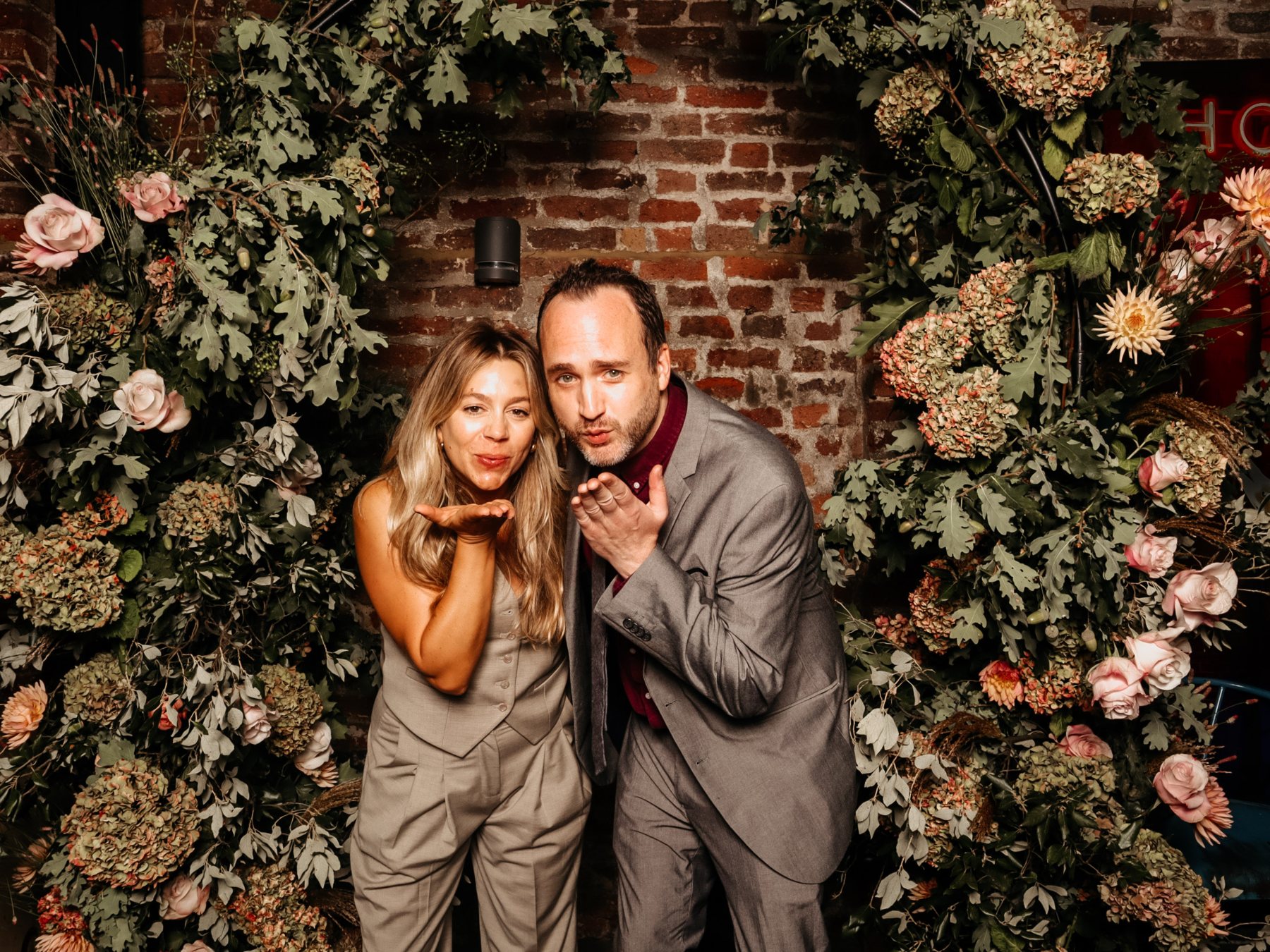 Guests at a wedding photo booth